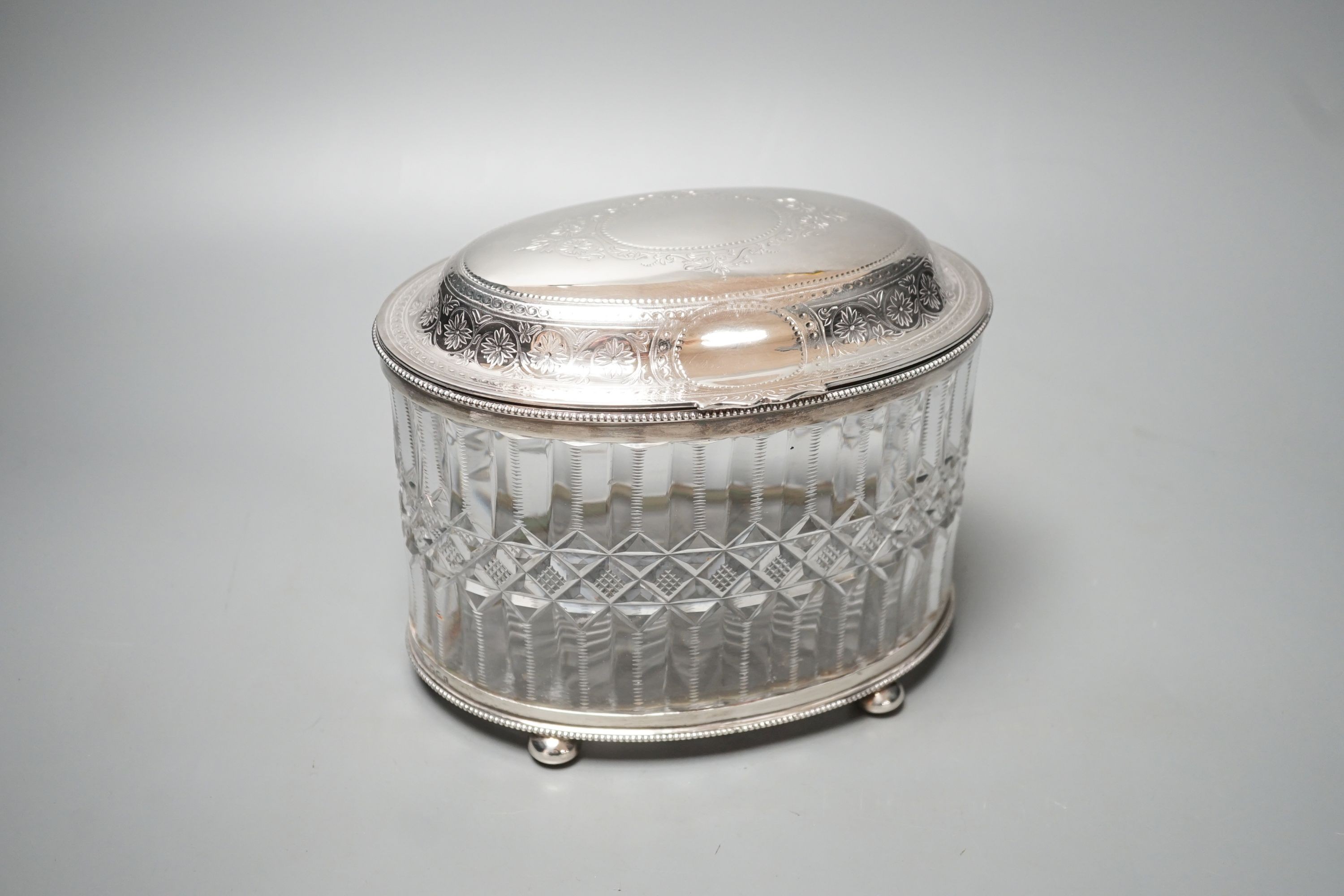 A Victorian engraved silver mounted cut glass oval biscuit barrel, double stamped maker's mark, London, 1874, height 15.5cm.